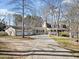 Well-maintained home featuring a spacious three-car garage, inviting front porch, and mature trees at 444 Pineview Dr, Canton, GA 30114