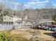 View of home, outdoor pool, pool house, and deck, including a gazebo with outdoor furniture for entertaining at 444 Pineview Dr, Canton, GA 30114