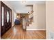 Welcoming foyer with hardwood floors, a staircase, and a decorative front door at 444 Pineview Dr, Canton, GA 30114