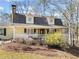 Charming home with a welcoming front porch and manicured landscaping, set on a picturesque lot at 444 Pineview Dr, Canton, GA 30114