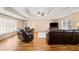 Relaxing living area with hardwood floors, comfortable leather furniture and a television at 444 Pineview Dr, Canton, GA 30114