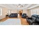 Spacious living room with a trey ceiling, hardwood floors and plenty of seating at 444 Pineview Dr, Canton, GA 30114