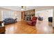 Inviting living room featuring a stone fireplace and gleaming hardwood floors at 444 Pineview Dr, Canton, GA 30114