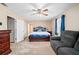 Spacious main bedroom has neutral paint, a ceiling fan, and an attached bathroom at 444 Pineview Dr, Canton, GA 30114