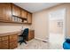 Functional home office with built-in desk, overhead cabinets, and a comfortable chair at 444 Pineview Dr, Canton, GA 30114
