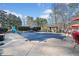 The pool area is covered with a safety cover and shows a diving board, slide, and outdoor seating at 444 Pineview Dr, Canton, GA 30114