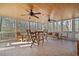 Screened porch offering plenty of seating with ceiling fans and view of the backyard at 444 Pineview Dr, Canton, GA 30114