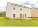 Back of the house featuring a grassy area, brick foundation and AC unit at 1587 Sungrown Way, Mcdonough, GA 30253