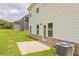 Back of the house featuring a grassy area and AC unit at 1587 Sungrown Way, Mcdonough, GA 30253
