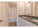 Bathroom features a double vanity and granite countertop at 1587 Sungrown Way, Mcdonough, GA 30253