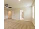 Bedroom featuring neutral carpet, two white doors, and natural light from a window at 1587 Sungrown Way, Mcdonough, GA 30253