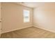 Bright bedroom featuring carpet, light walls and natural lighting at 1587 Sungrown Way, Mcdonough, GA 30253