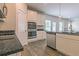 A gourmet kitchen has stainless steel appliances, granite countertops and an island at 1587 Sungrown Way, Mcdonough, GA 30253