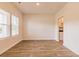 This is a bright and airy living room with wood flooring and lots of natural light at 1587 Sungrown Way, Mcdonough, GA 30253
