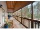 Covered back porch with outdoor seating and a grill perfect for entertaining and enjoying the outdoors at 244 Sherbrook Nw Ct, Marietta, GA 30064