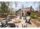 Backyard showcasing a stone patio, fire pit, and ample seating, ideal for outdoor gatherings and relaxation at 244 Sherbrook Nw Ct, Marietta, GA 30064