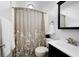 Cozy bathroom with black vanity, updated fixtures, and shower at 244 Sherbrook Nw Ct, Marietta, GA 30064