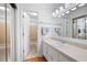Well-lit bathroom with large mirror, spacious vanity, and shower/tub combo at 244 Sherbrook Nw Ct, Marietta, GA 30064