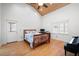 Spacious bedroom with hardwood floors, high ceilings, and a large window overlooking the backyard at 244 Sherbrook Nw Ct, Marietta, GA 30064