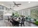 Bright dining room with a large table, ample natural light, and stylish ceiling fans at 244 Sherbrook Nw Ct, Marietta, GA 30064