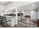 Modern kitchen with white cabinets, an island, and an open view to the living room at 244 Sherbrook Nw Ct, Marietta, GA 30064