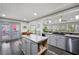 Open-concept kitchen with a center island, modern appliances, and seamless connection to outdoor spaces at 244 Sherbrook Nw Ct, Marietta, GA 30064