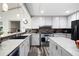 Modern kitchen featuring white cabinets, stainless steel appliances, and a stylish backsplash at 244 Sherbrook Nw Ct, Marietta, GA 30064