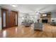 Bright living room featuring a stone fireplace, hardwood floors, and stylish seating at 244 Sherbrook Nw Ct, Marietta, GA 30064