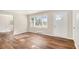 Bright living room with hardwood floors, a large window, and a stylish front door at 2716 Wedgewood Ter, Decatur, GA 30032