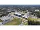 Wide aerial shot of school athletic complex with football stadium, school buildings, and large parking lots at 58 Canton St # 302, Alpharetta, GA 30009