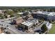 Aerial view of a town with retail, restaurants, apartments, and single Gathering homes at 58 Canton St # 302, Alpharetta, GA 30009