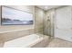 Modern bathroom with a glass-enclosed shower, soaking tub, and contemporary tile, offering a spa-like experience at 58 Canton St # 302, Alpharetta, GA 30009