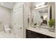 Bright bathroom with a marble countertop, dark wood vanity, and white trim at 58 Canton St # 302, Alpharetta, GA 30009