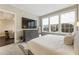 Bright bedroom with a large window, TV, and a view into the living room, creating an inviting and airy space at 58 Canton St # 302, Alpharetta, GA 30009