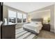 Cozy bedroom with natural light, a comfortable bed, stylish decor, and a serene ambiance at 58 Canton St # 302, Alpharetta, GA 30009