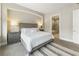 Serene bedroom featuring a comfortable bed, nightstands, and an ensuite bathroom for a relaxing retreat at 58 Canton St # 302, Alpharetta, GA 30009