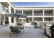 Outdoor courtyard with dining and grilling spaces at 58 Canton St # 302, Alpharetta, GA 30009
