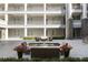 Serene courtyard with seating, planters, and manicured greenery at 58 Canton St # 302, Alpharetta, GA 30009