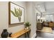 Hallway with hardwood floors, large artwork, and a view to the living room at 58 Canton St # 302, Alpharetta, GA 30009