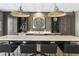 Kitchen features marble countertops, pendant lighting, a decorative clock, and barstool seating at 58 Canton St # 302, Alpharetta, GA 30009