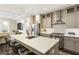 Well-lit kitchen with stainless steel appliances, large island with seating, and modern fixtures at 58 Canton St # 302, Alpharetta, GA 30009