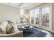Bright living room featuring large windows, stylish furniture, and a cozy atmosphere with a balcony at 58 Canton St # 302, Alpharetta, GA 30009