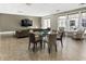 Comfortable community living room with couch, chairs, TV, and round table for relaxing at 58 Canton St # 302, Alpharetta, GA 30009