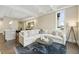 Spacious living area open to the kitchen, with a sectional sofa, recessed lighting, and stylish decor at 58 Canton St # 302, Alpharetta, GA 30009