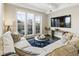 Cozy living room with a comfortable sectional sofa and a door leading to the balcony at 58 Canton St # 302, Alpharetta, GA 30009