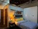 Bedroom featuring vintage decor, ample closet space and warm lighting at 184 Sw Walker Street # E, Atlanta, GA 30313