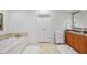 Bright bathroom with marble floors, soaking tub, double vanity at 3286 Northside Nw Pkwy # 304, Atlanta, GA 30327
