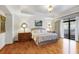 Bright bedroom with hardwood floors, natural light, and a walkout balcony at 3286 Northside Nw Pkwy # 304, Atlanta, GA 30327