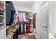 Spacious walk-in closet featuring custom shelving, hanging racks, and hardwood floors at 3286 Northside Nw Pkwy # 304, Atlanta, GA 30327