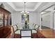 Bright dining room with glass table, elegant chandelier, and ornate wood cabinet at 3286 Northside Nw Pkwy # 304, Atlanta, GA 30327